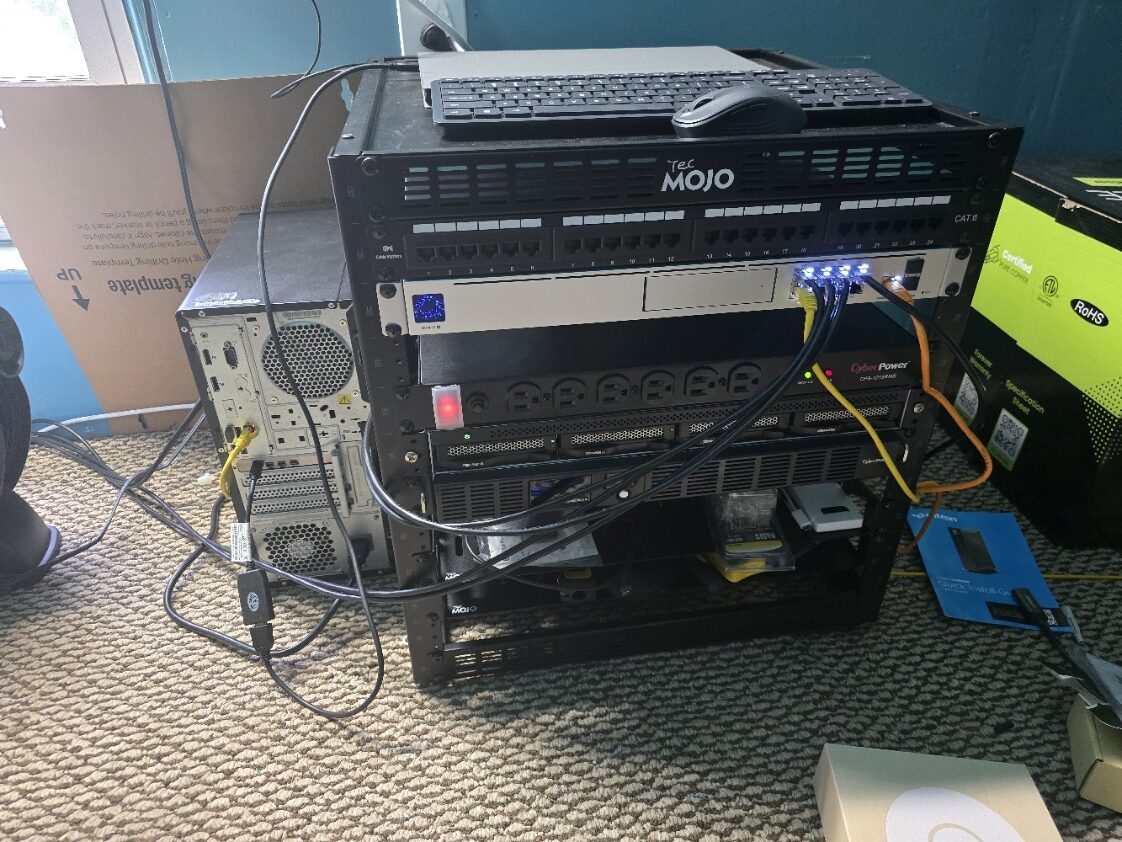 Home server rack with a network switch, power distribution, and storage, cables running straight to the switch